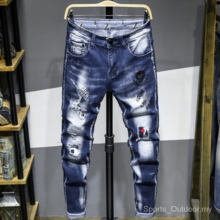 Otoño nuevos hombres Ripped Jeans moda agujero parche letra impresión Slim Denim pantalones Hip Hop Rock motocicleta Streetwear tendencia GAZW