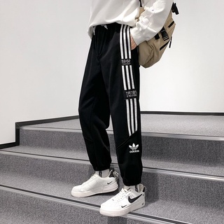 Adidas New Four Seasons moda Casual impresión lateral versátil pareja pantalones