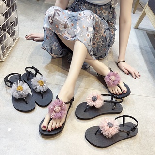 Sandalias de flores de las mujeres de verano zapatos planos 2021 nuevo estilo de hadas estudiante pellizcado pies roma playa vacaciones zapatos de playa