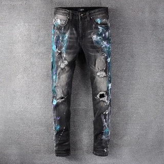 2020 moda de calle nueva marca Amiri color pintura en aerosol jeans rasgados personalidad de los hombres pantalones delgados con graffiti