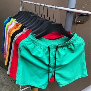 Cuartos de pantalones de los hombres pantalones de playa de tres partes pantalones cortos de secado rápido caramelo suelto delgado pantalones cortos deportivos