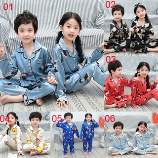 nueva llegada niños bebé lindo pijama niños de dibujos animados impresión ropa de dormir pijamas conjunto de manga larga mancha de seda niños niñas pijamas traje