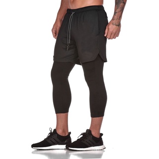 Muscular hombre deportes al aire libre correr fitness entrenamiento falso dos de secado rápido fondo de nueve puntos pantalones